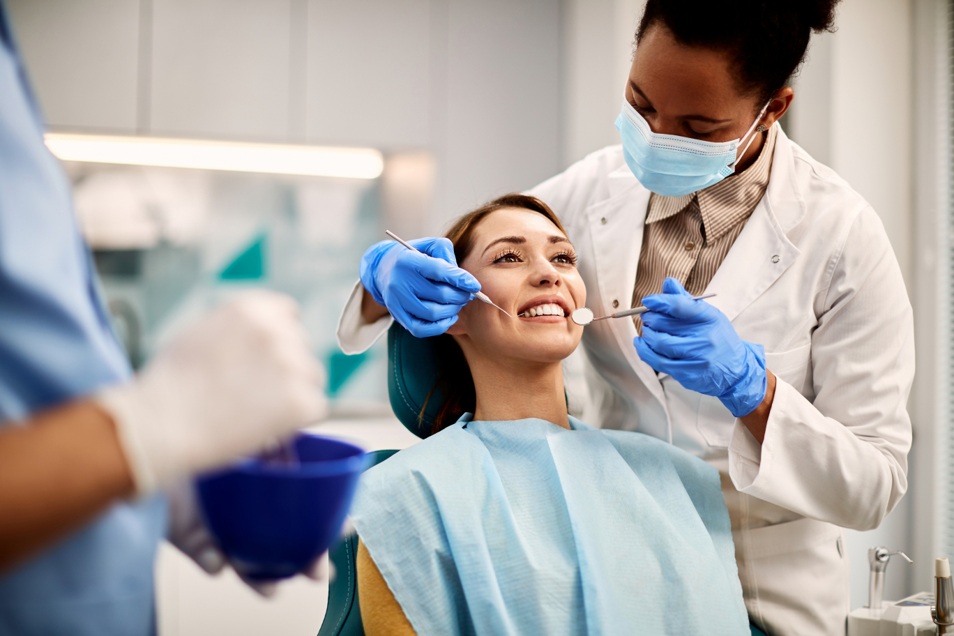 young-smiling-woman-having-dental-exam-at-dentist-2024-12-13-22-13-38-utc